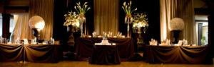 a table with candles and flowers