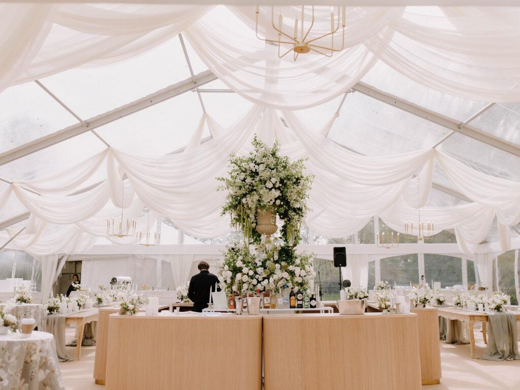 Elegant tented wedding reception setup.