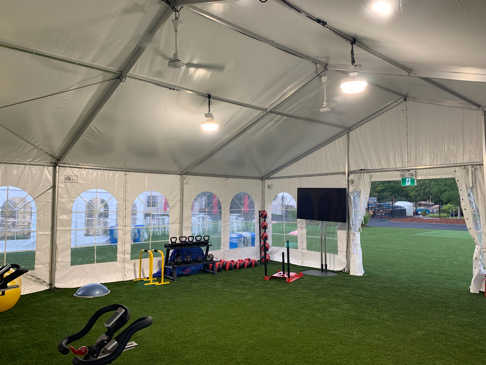 Indoor gym setup in a tent