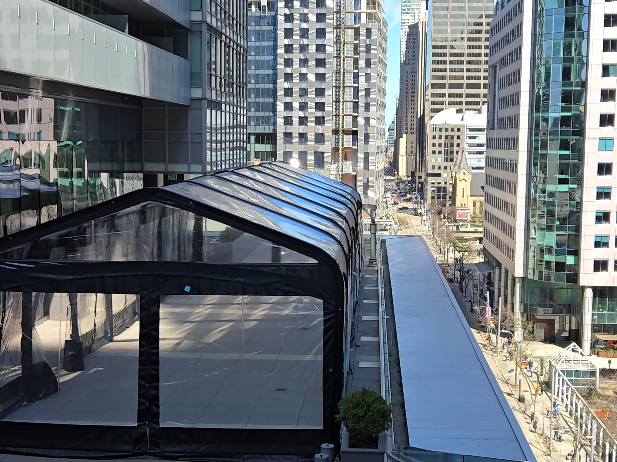 Tent structure overlooking city buildings