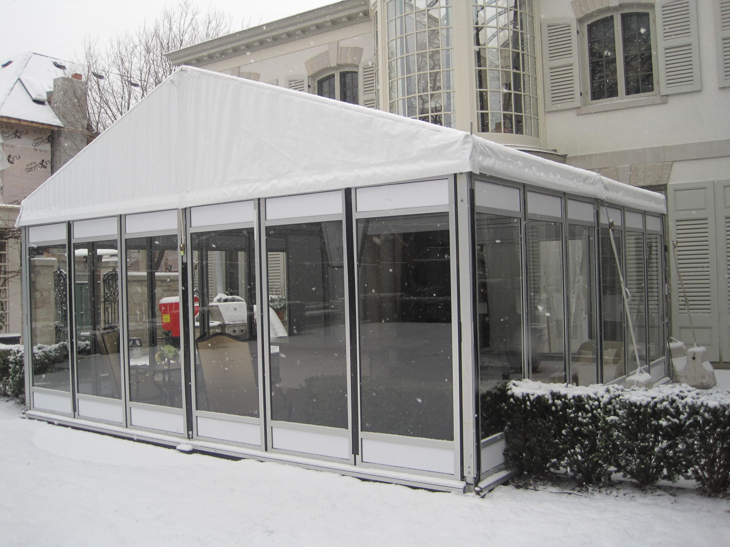 Snowy outdoor glass structure tent