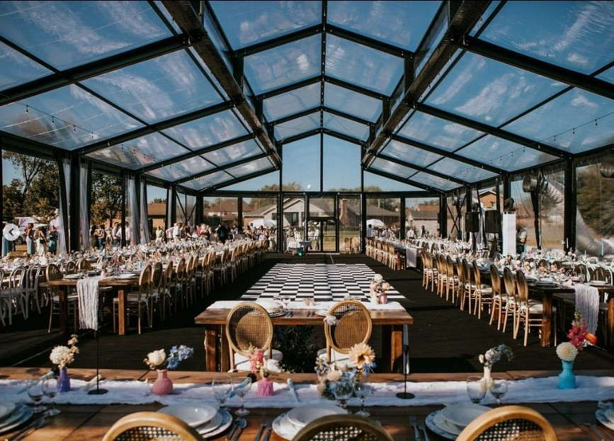 Elegant wedding reception under glass tent