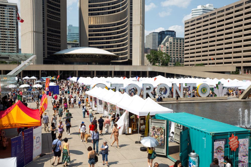 Crowded outdoor festival in Toronto with Pop Up Tent.
