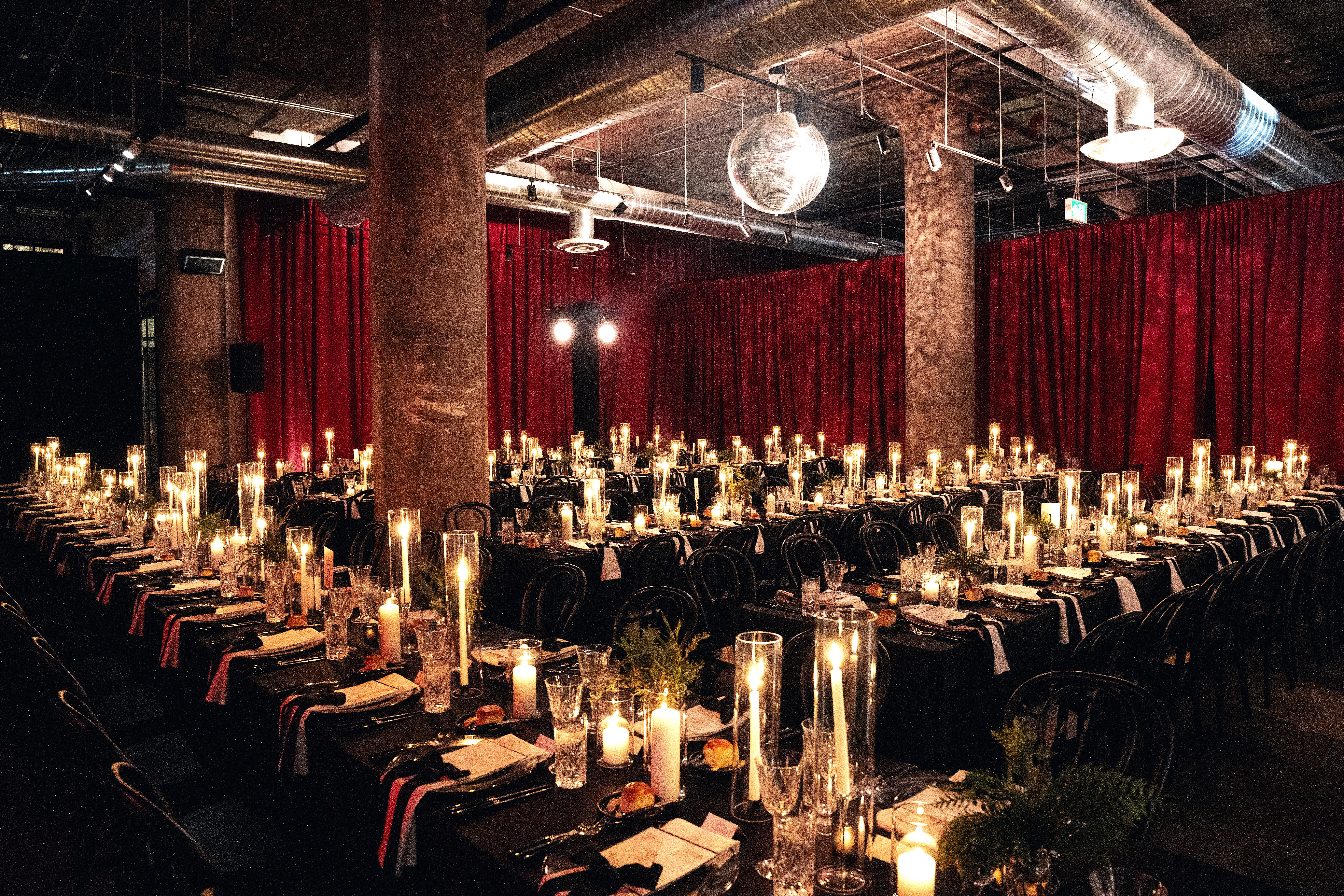 Elegant dining setup with candles with Room drapery.